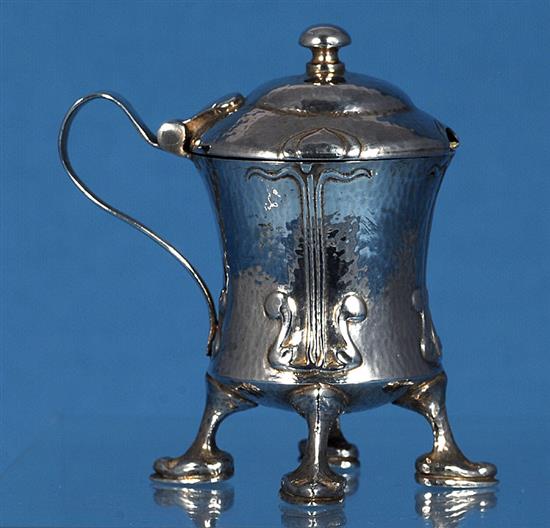 An Edwardian Arts and Crafts Cymric silver mustard pot, designed by Archibald Knox, for Liberty & Co, numbered 409, height 70mm,